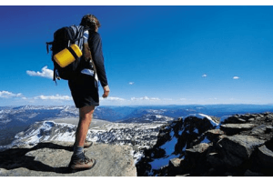 man on top of mountain hiking